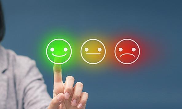 Consumer pressing satisfaction buttons to rate a brand, ranging from bad and acceptable to good